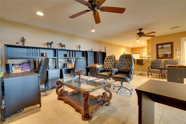 living room with light tile patterned floors, visible vents, and recessed lighting