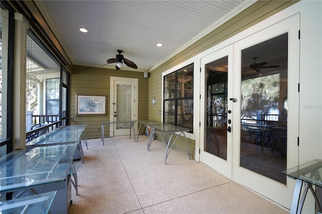 sunroom featuring ceiling fan