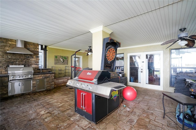 view of patio / terrace with ceiling fan, grilling area, exterior kitchen, french doors, and a sink