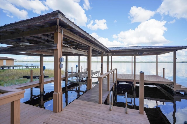 view of dock with a water view and boat lift