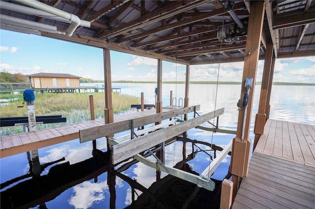 dock area featuring a water view and boat lift