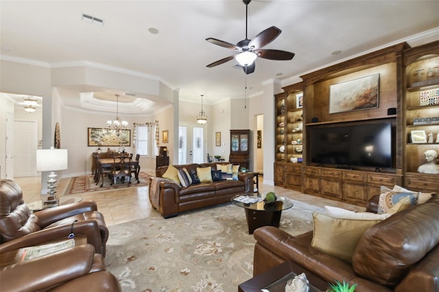 tiled living room with ceiling fan with notable chandelier and ornamental molding