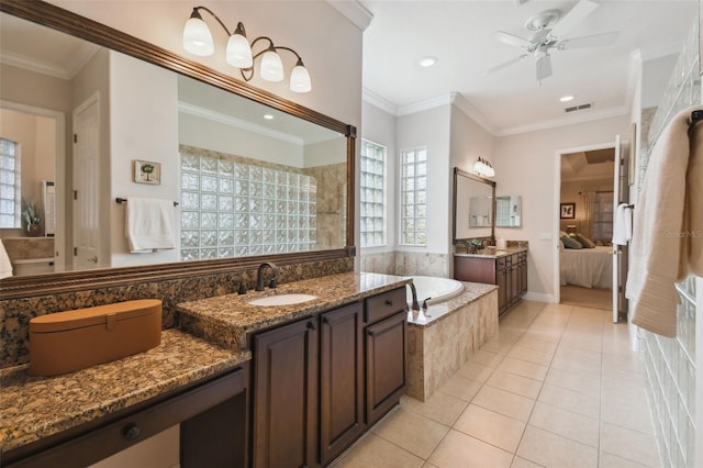 bathroom with ceiling fan, tiled bath, tile patterned flooring, vanity, and crown molding