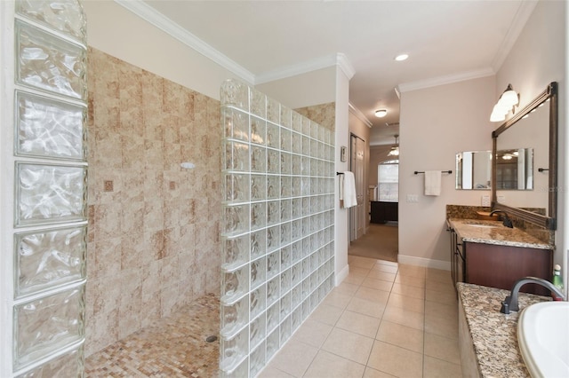 bathroom with tile patterned floors, crown molding, plus walk in shower, and vanity