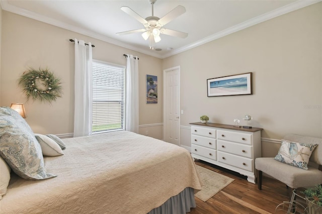 bedroom with ceiling fan, dark hardwood / wood-style flooring, and crown molding