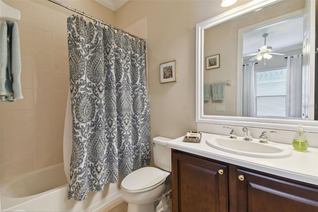 full bathroom featuring vanity, ceiling fan, crown molding, toilet, and shower / bathtub combination with curtain