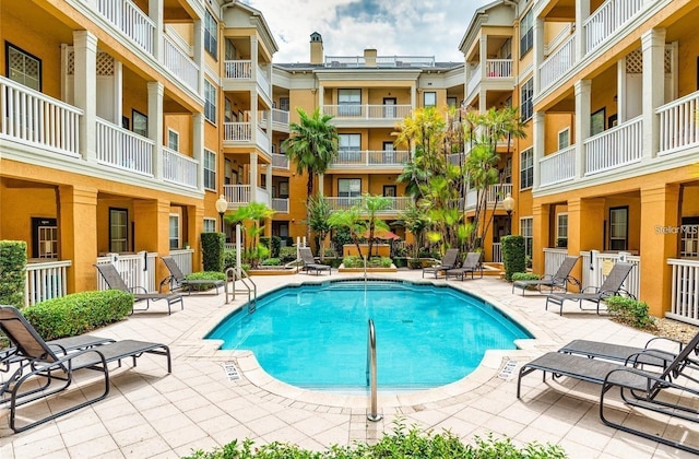 view of swimming pool with a patio area