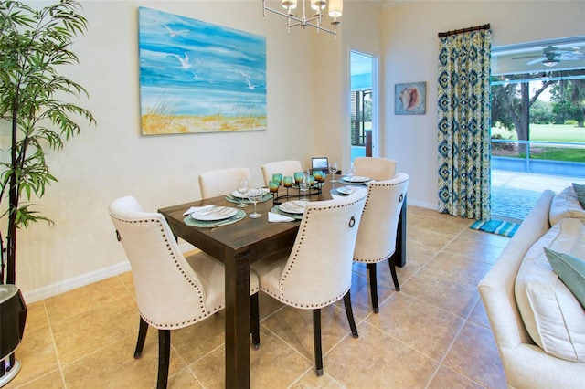 dining space featuring a notable chandelier and light tile patterned floors