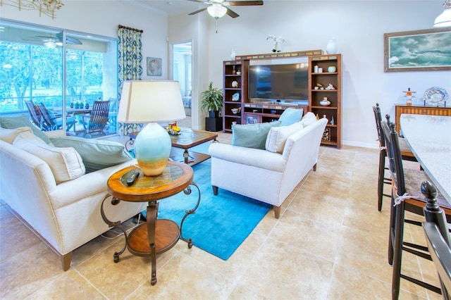 living room featuring ceiling fan, light tile patterned floors, and ornamental molding