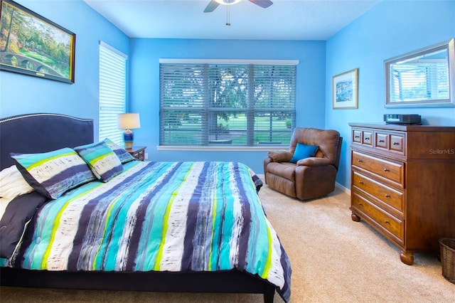 bedroom featuring ceiling fan and carpet floors