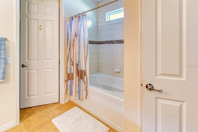 bathroom featuring shower / bath combination with curtain and tile patterned flooring