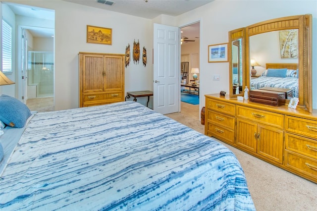 carpeted bedroom featuring connected bathroom