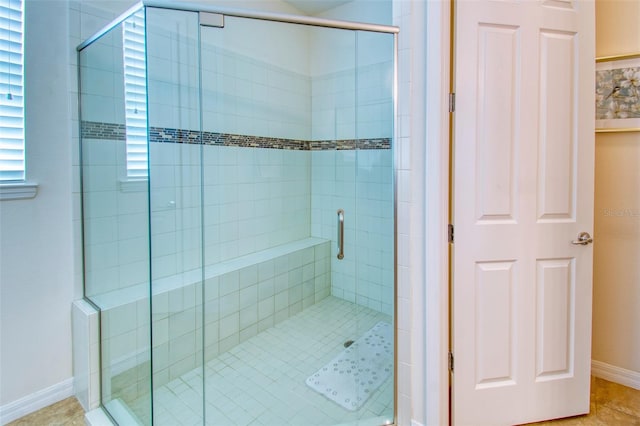 bathroom featuring tile patterned flooring and walk in shower