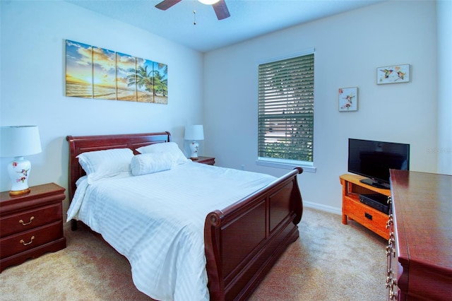 bedroom with ceiling fan and carpet floors