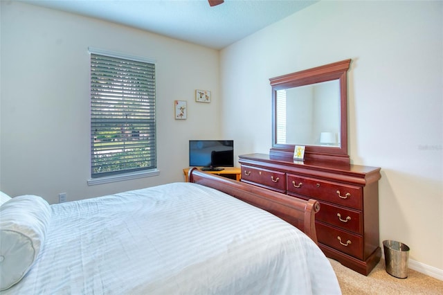 bedroom with ceiling fan and carpet floors