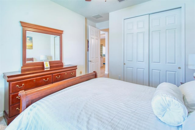 bedroom featuring a closet and carpet floors