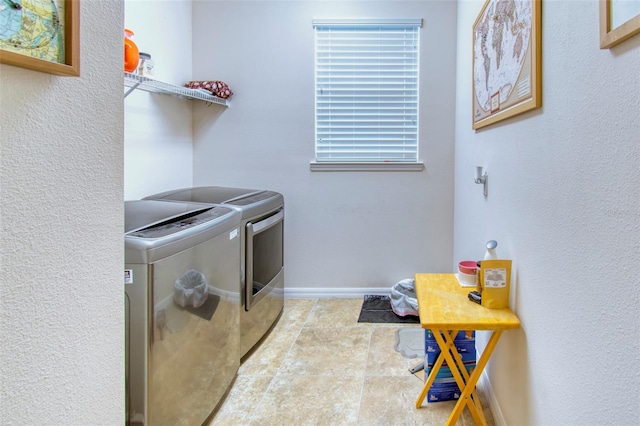 laundry room with separate washer and dryer and light tile patterned floors