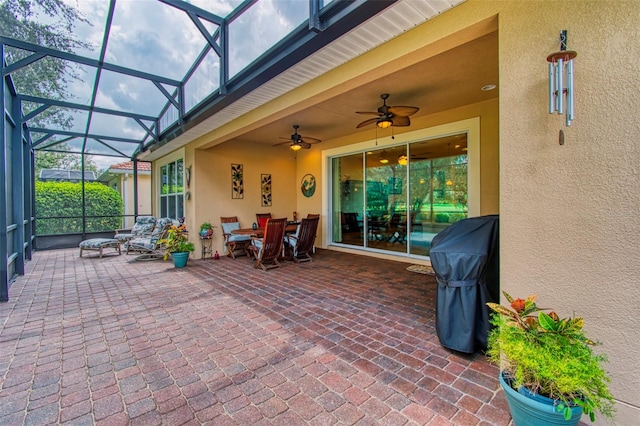 view of patio / terrace with a lanai and ceiling fan