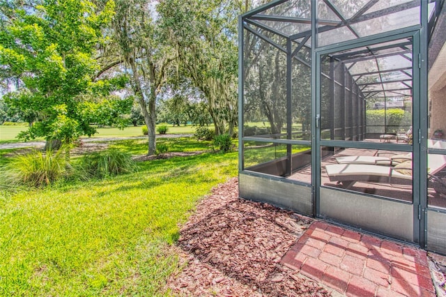 view of yard with glass enclosure