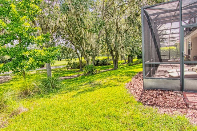 view of yard featuring a lanai