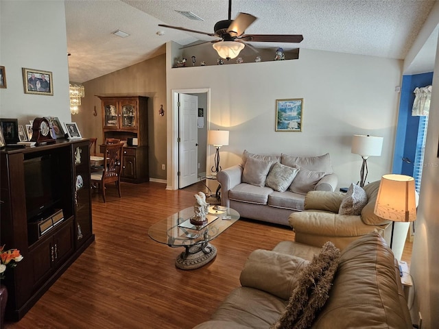 living room featuring lofted ceiling, hardwood / wood-style floors, ceiling fan, and a textured ceiling