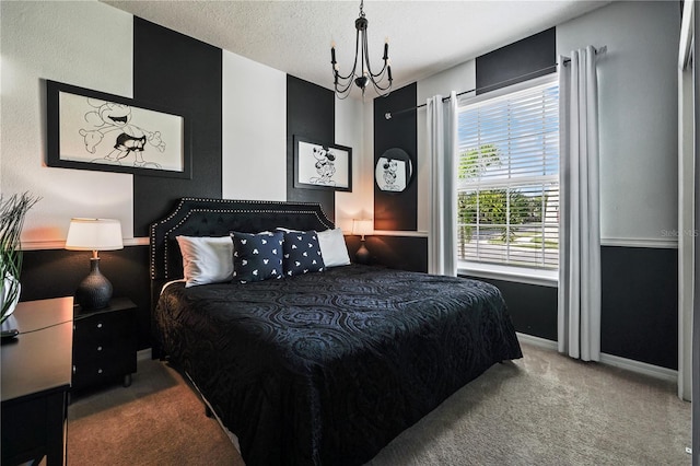 carpeted bedroom with a textured ceiling and a chandelier