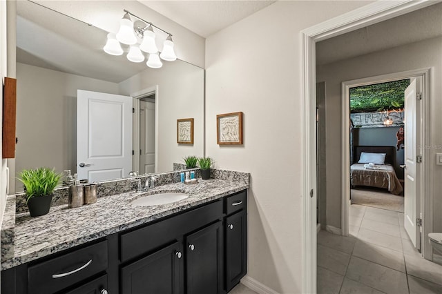 bathroom with tile patterned flooring and vanity