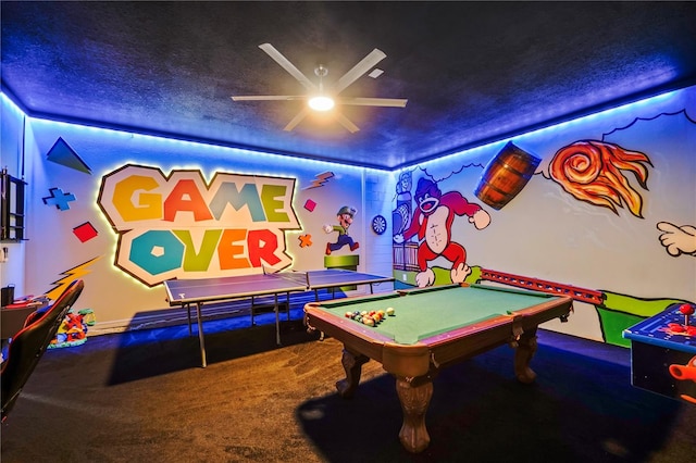 recreation room featuring a textured ceiling, carpet, ceiling fan, and pool table