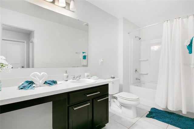 full bathroom with tile patterned floors, shower / bath combo with shower curtain, vanity, and toilet