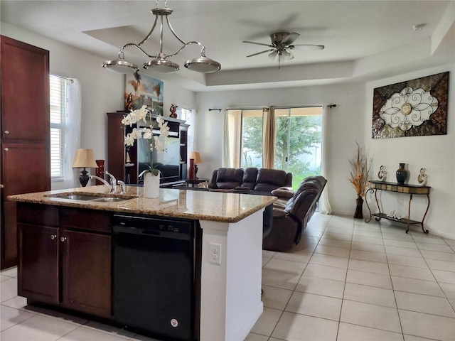 kitchen featuring dishwasher, a healthy amount of sunlight, a tray ceiling, and sink