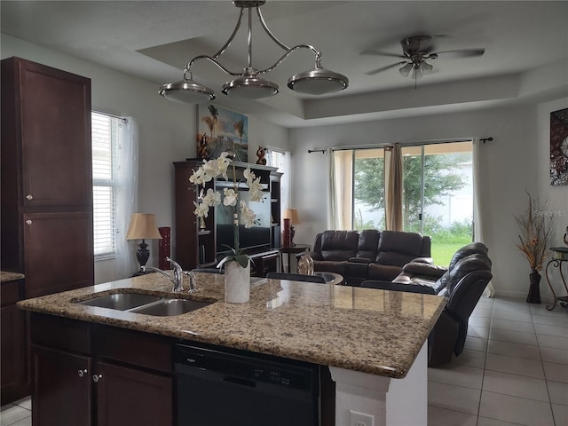 kitchen featuring dishwasher, sink, a raised ceiling, and light tile patterned flooring