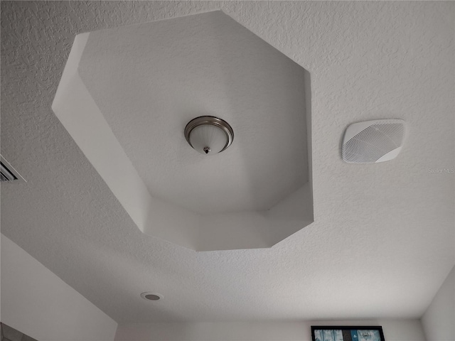 interior details with a textured ceiling