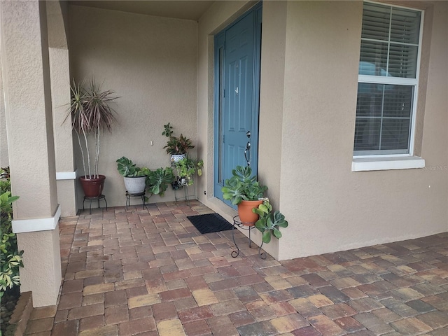 entrance to property with a patio area