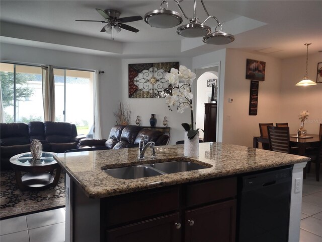 kitchen featuring light tile patterned floors, sink, light stone countertops, ceiling fan, and black dishwasher