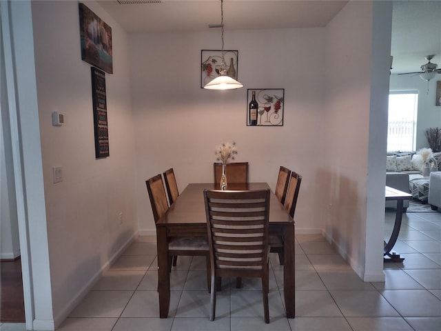 dining room with ceiling fan and light tile patterned floors