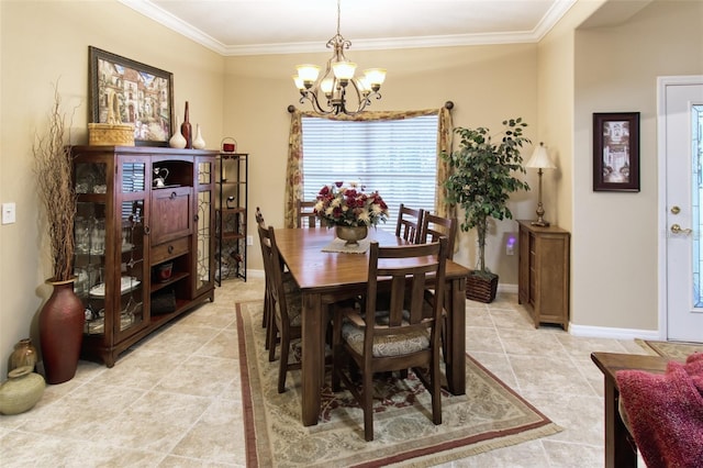 dining space with light tile patterned floors, ornamental molding, and a chandelier