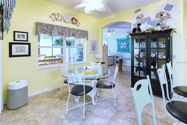 dining area with ceiling fan and light tile patterned floors