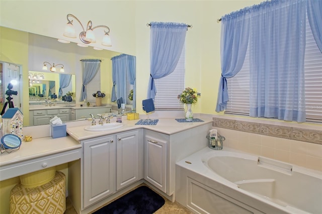 bathroom with a tub and vanity