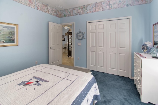 carpeted bedroom with a closet