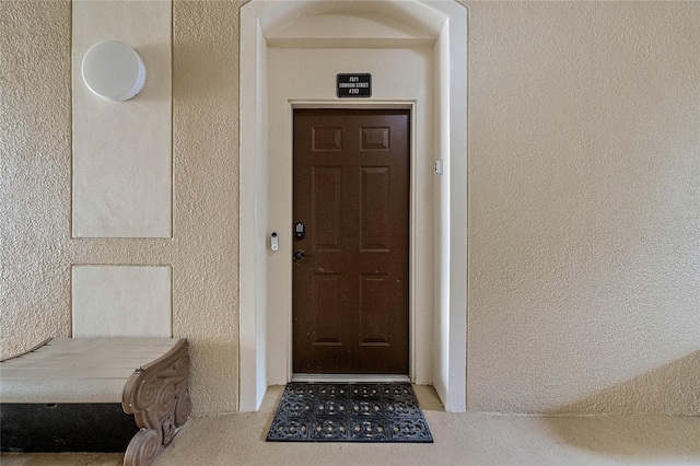 7671 Comrow St Unit 202, Kissimmee, FL 34747 - doorway to property with stucco siding