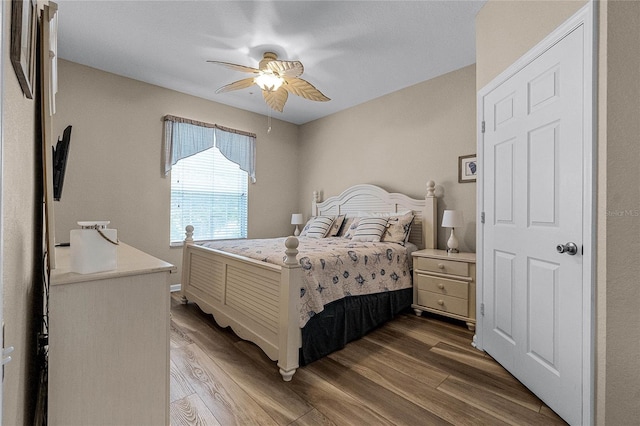 bedroom featuring dark wood-type flooring and ceiling fan