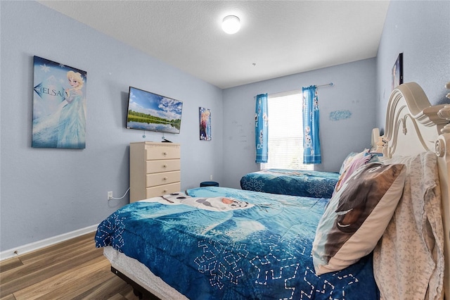 7671 Comrow St Unit 202, Kissimmee, FL 34747 - bedroom featuring wood finished floors and baseboards