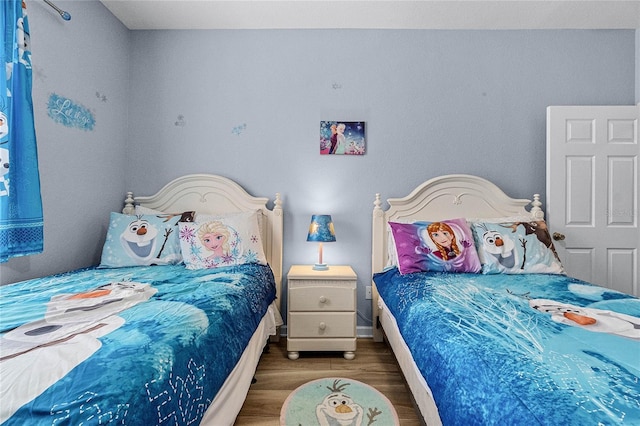 7671 Comrow St Unit 202, Kissimmee, FL 34747 - bedroom with wood finished floors and baseboards