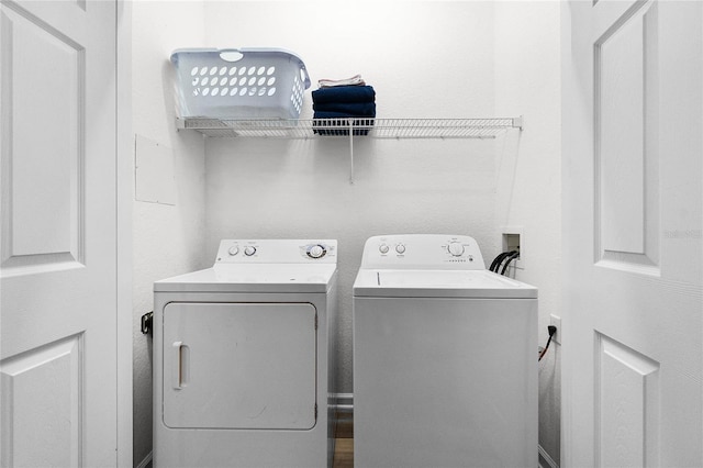 washroom featuring washer and clothes dryer