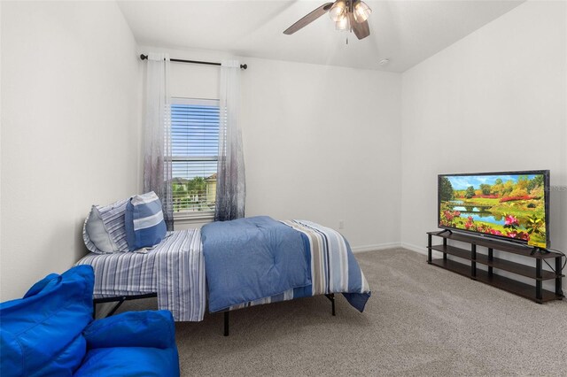 bedroom with ceiling fan and carpet floors