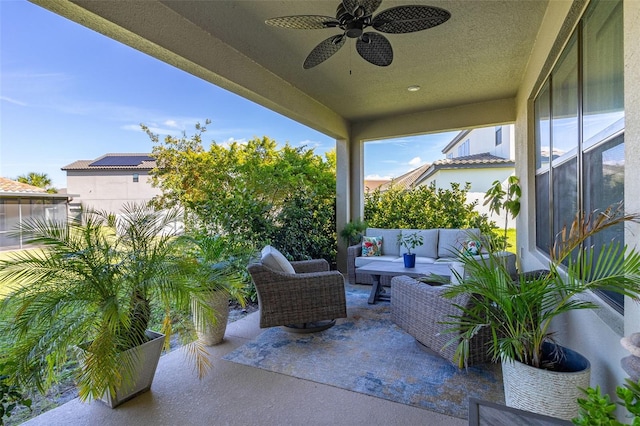 view of patio with outdoor lounge area and ceiling fan