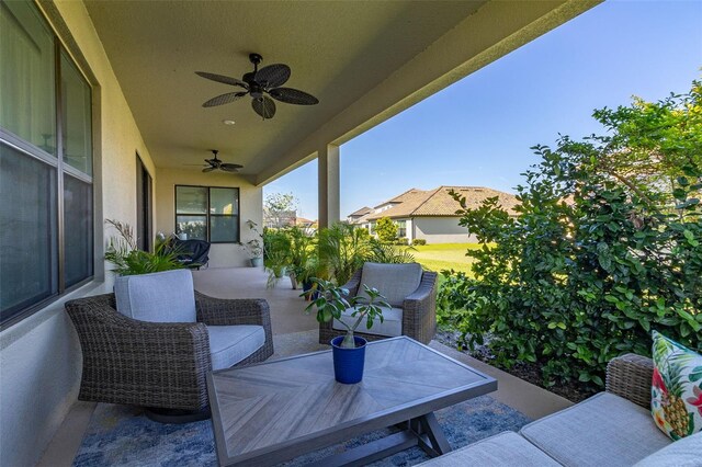 view of patio with an outdoor hangout area and ceiling fan