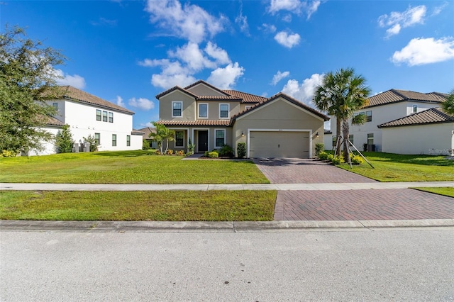 mediterranean / spanish-style house with a front lawn and a garage