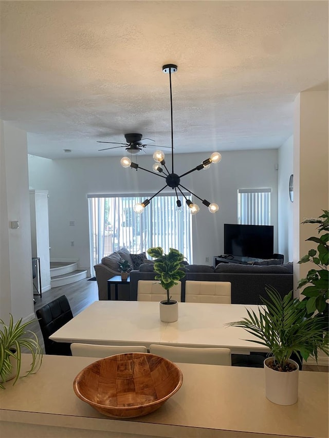 dining area with hardwood / wood-style flooring and a chandelier