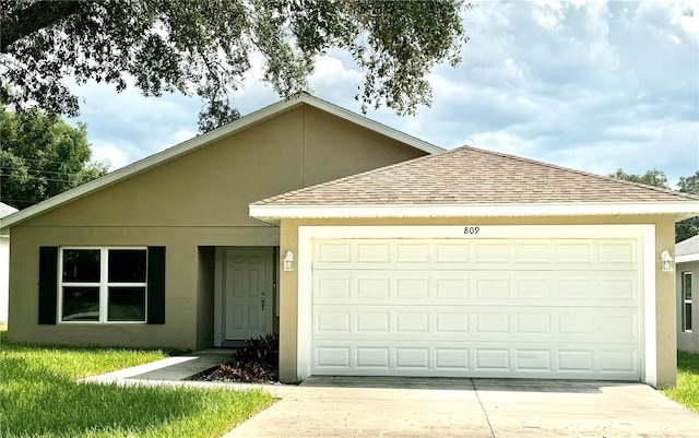 ranch-style home featuring a garage